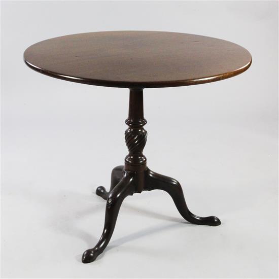 A George III mahogany circular tilt top tripod table, W.3ft